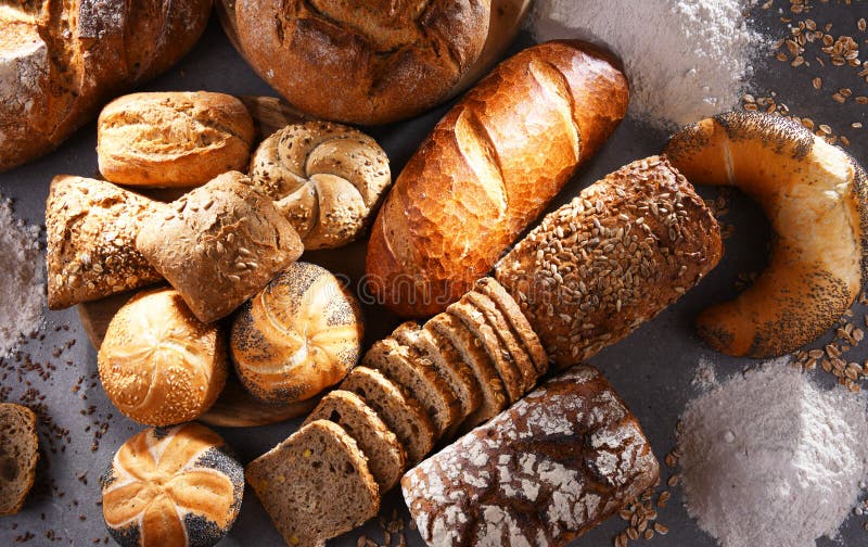 Assorted Bakery Products Including Loafs Of Bread And Rolls Stock Photo