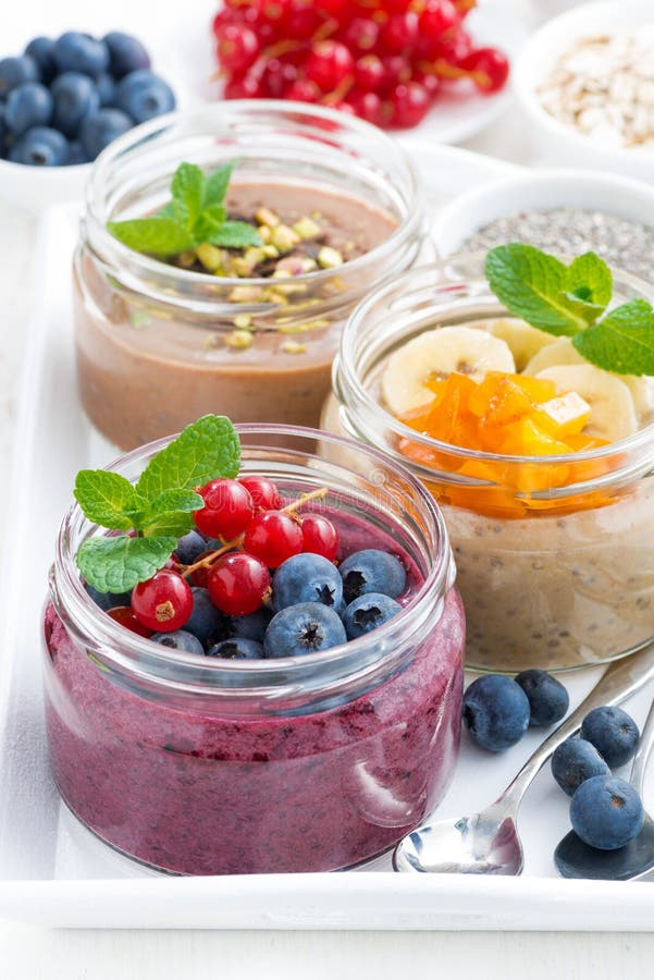 Assorted Breakfast of Chia Seeds and Fruits in Jars, Closeup Stock