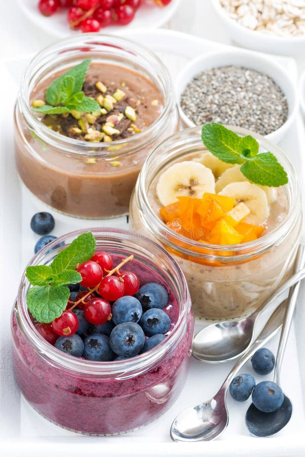 Assorted Breakfast of Chia Seeds and Fruits in Jars, Top View Stock