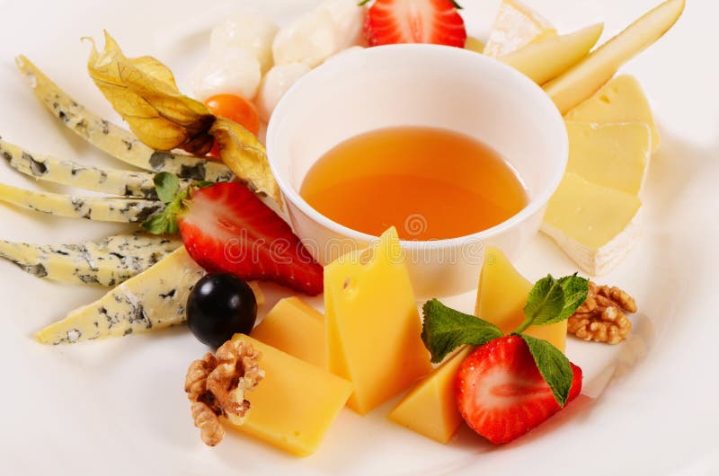 Assorted cheese with honey stock image. Image of roquefort 41388583