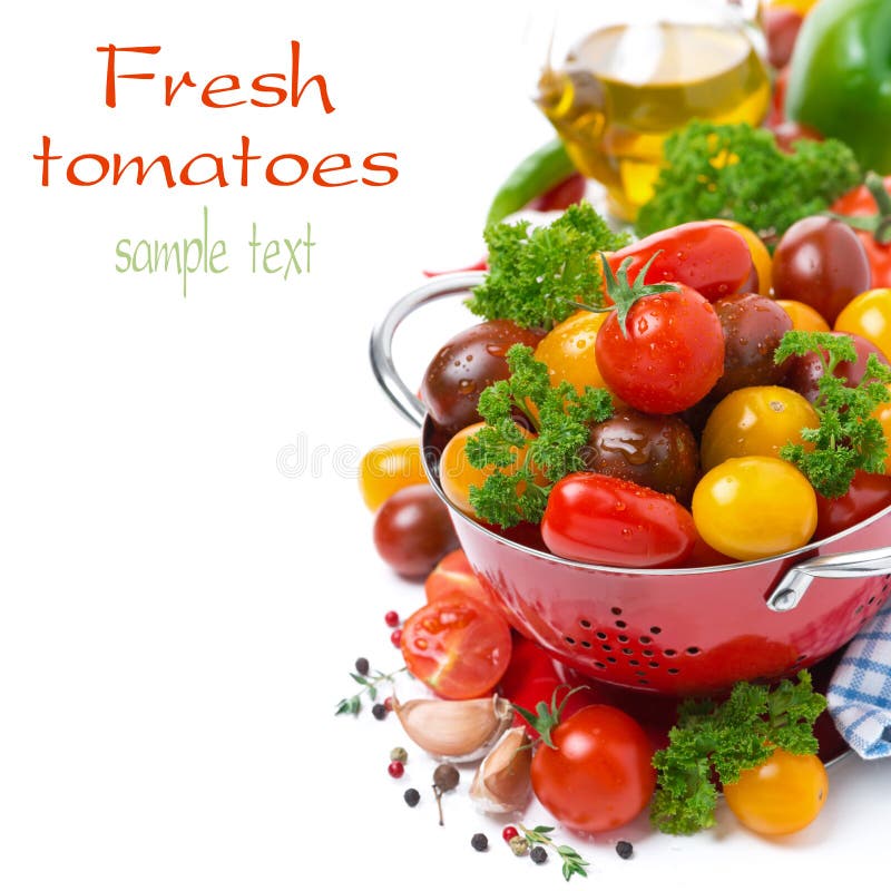 Assorted cherry tomatoes in a colander, spices, olive oil stock photo
