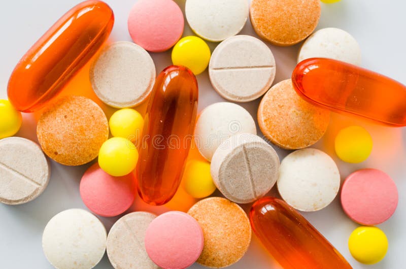 Assorted colorful tablets, pills, drugs on white background. Medication and healthcare concept. Assorted colorful tablets, pills, drugs isolated on white royalty free stock photo Assorted colorful tablets, pills, drugs on white background. Medication and healthcare concept. Assorted colorful tablets, pills, drugs isolated on white royalty free stock photo
