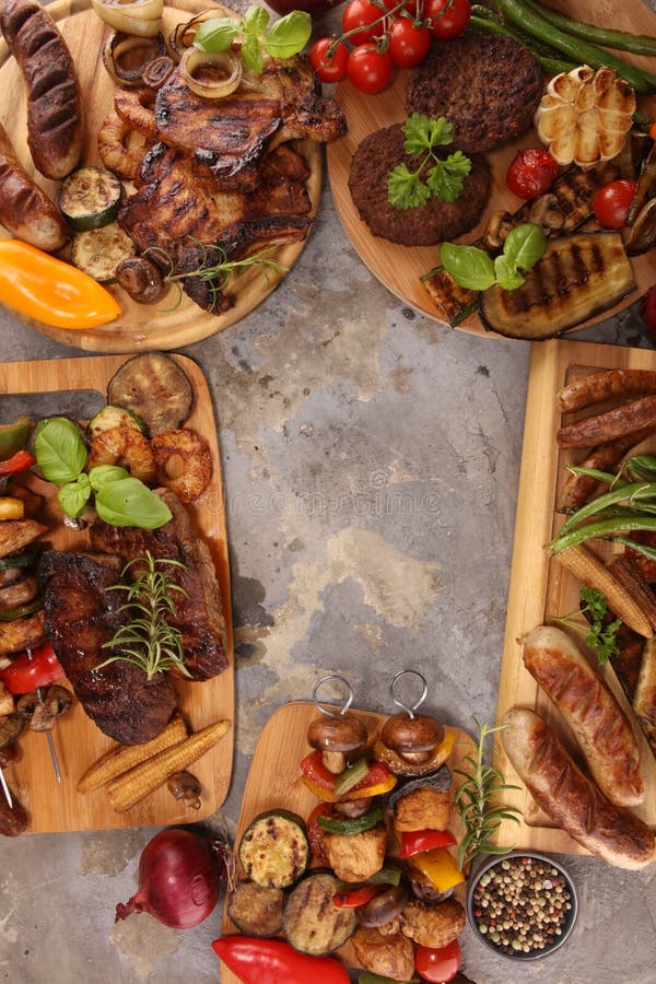 Assorted Delicious Grilled Meat with Vegetable on Rustic Table Stock