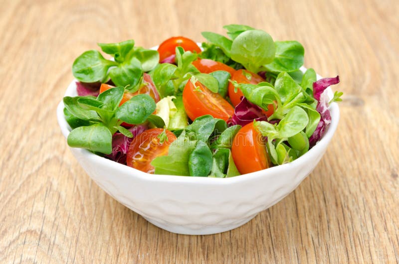 Assorted fresh salad and cherry tomatoes in a bowl