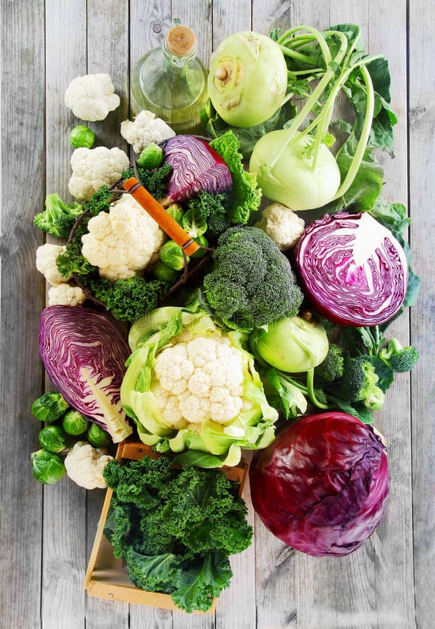 Close up Assorted Healthy Fresh Vegetables on Wooden Table. Emphasizing Cabbage, Broccoli, Cauliflower and Brussels Sprout. Paleo cauliflower stock images, royalty-free photos and pictures