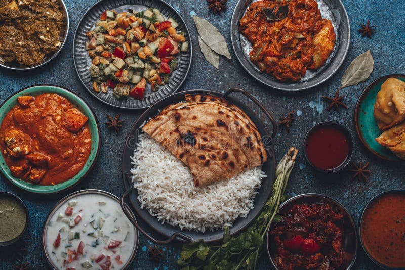 Assorted Indian Ethnic Food Buffet on Rustic Concrete Table from Above ...