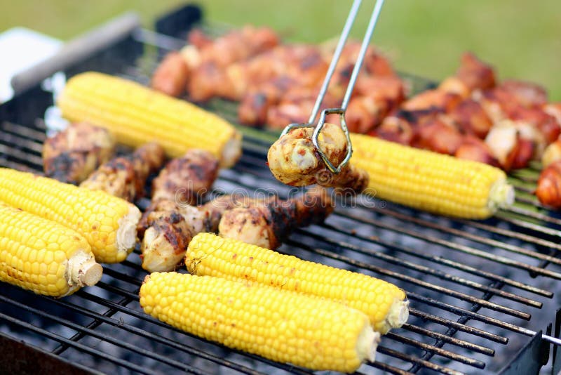 Assorted meat and vegetables on barbecue gril royalty free stock photo