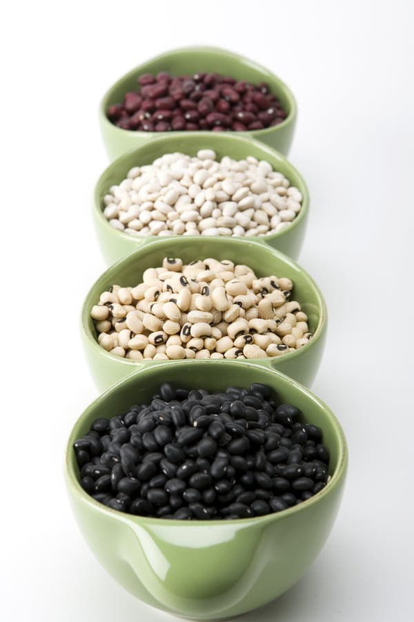 Assorted variety of mixed dried beans in green a ceramic dish. Assorted variety of mixed dried beans in green a ceramic dish