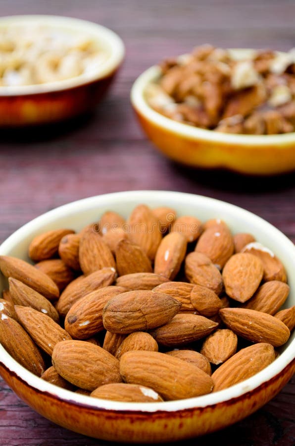 Assorted Nuts in Dishes on Wooden Table Stock Photo Image of grunge