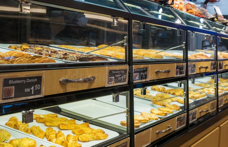 Pastry And Breads Arranged On Tray At Bakery Shop Stock Photo Image