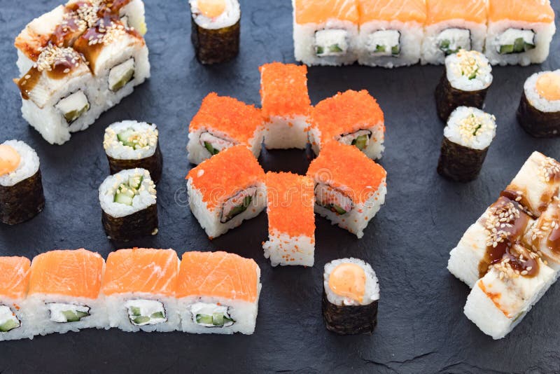 Assorted from the Roll. Japanese Cuisine. Rolls on a Stone Platter