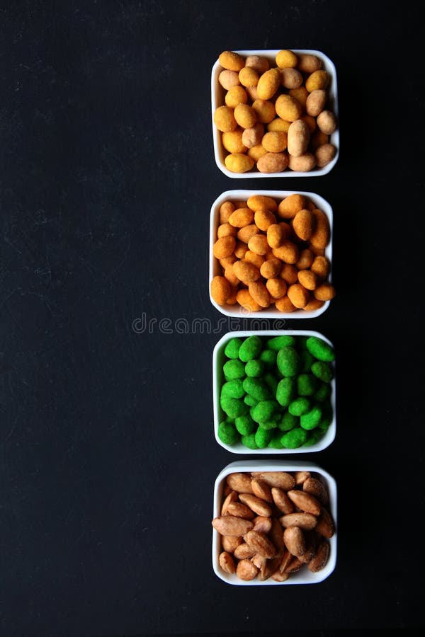 Assorted Salted Nuts for Beer. Multicolored Glaze on Nuts. Beer Snacks