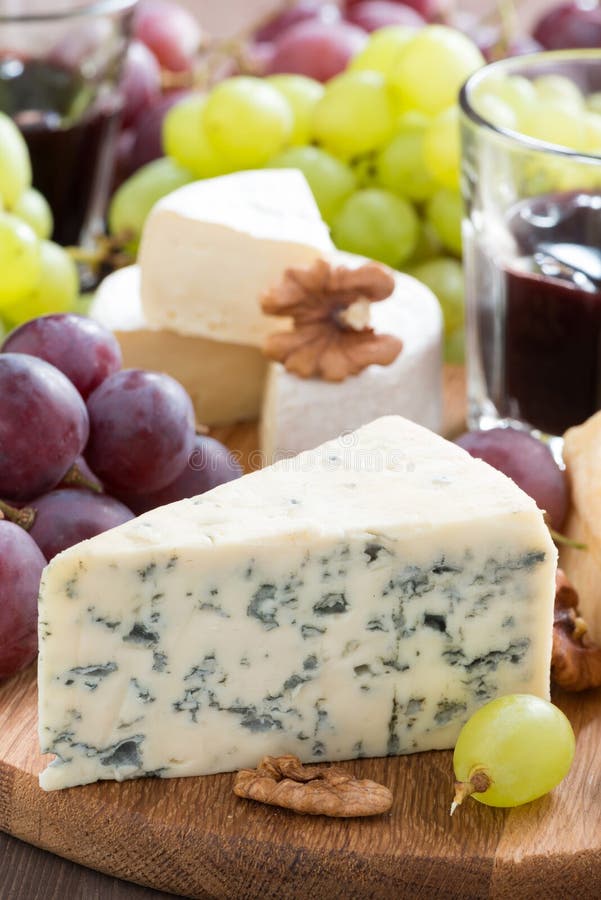 Red Wine with Blue Cheese and Ealnuts on Wooden Background Stock Image