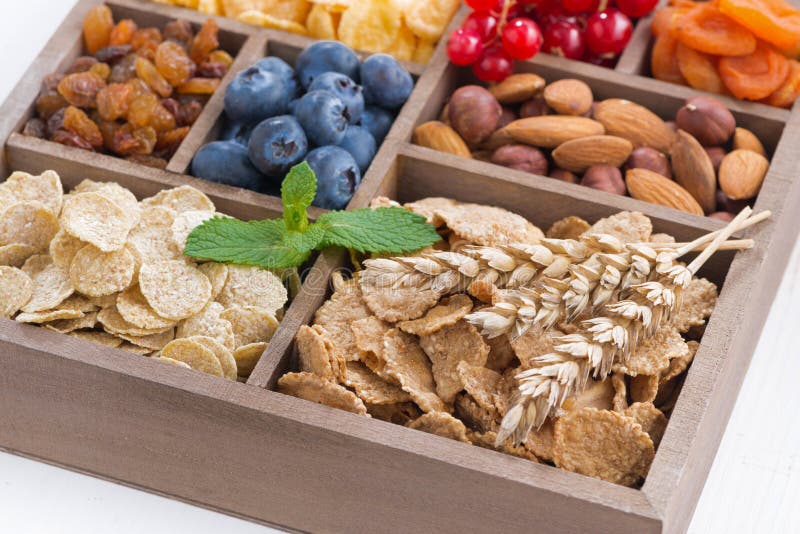 Assortment of Breakfast Cereal, Dried Fruit, Berries and Nuts Stock