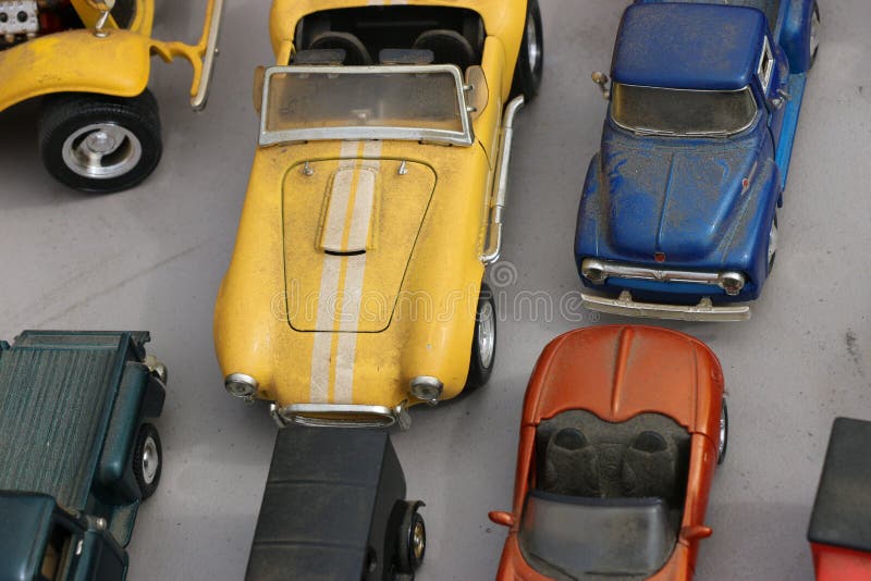 Assortment of Collectible, Vintage Metal Toy Cars Arranged on a Table