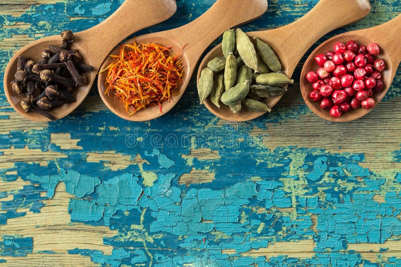 https://thumbs.dreamstime.com/b/assortment-colorful-spices-wooden-spoons-assortment-colorful-spices-wooden-spoons-cloves-saffron-cardamom-pink-116930156.jpg