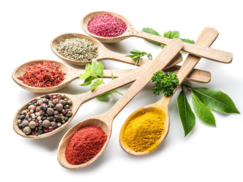 Assortment of colorful spices in the wooden spoons