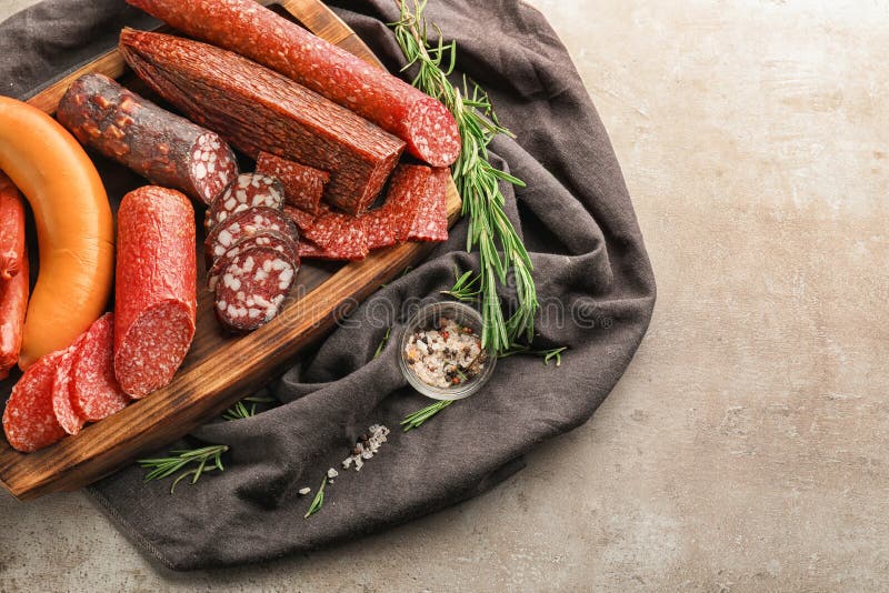 Assortment of delicious sausages on wooden board royalty free stock images Assortment of delicious sausages on wooden board royalty free stock images