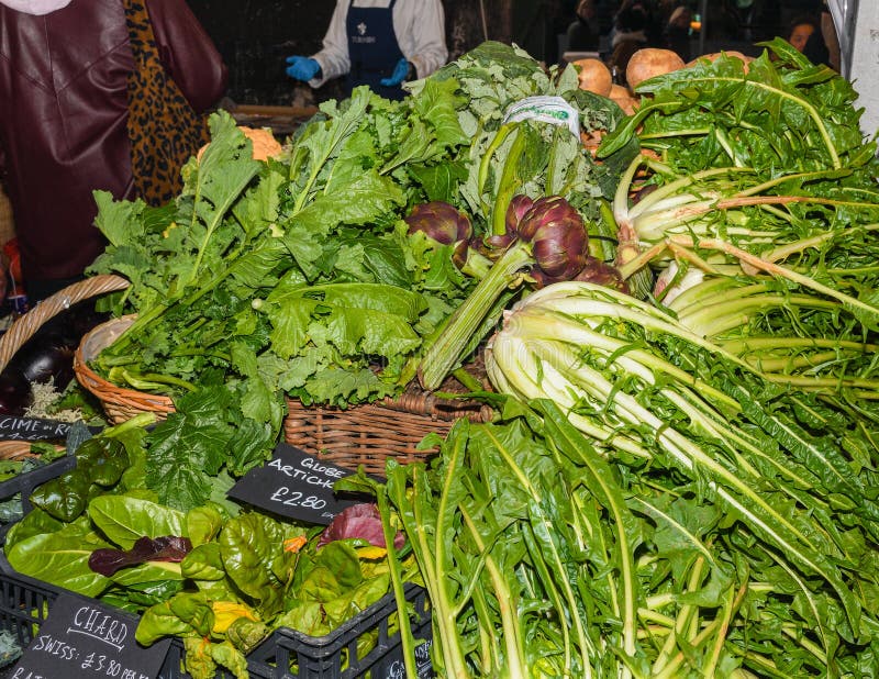 Assortment of Fresh Salads and Vegetables at the Market Stock Image
