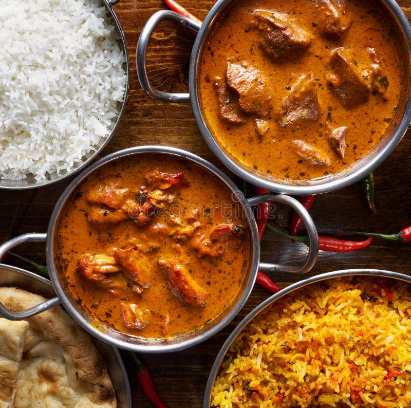 Assortment of Indian Curry and Rice Dishes Stock Photo - Image of naan