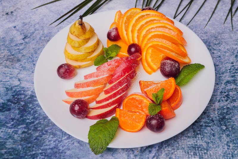 Assortment Of Sliced Fruits On Plate With Drops Stock Photo Image Of
