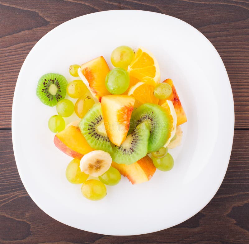 Assortment of Sliced Fruits on Plate Stock Image Image of tasty
