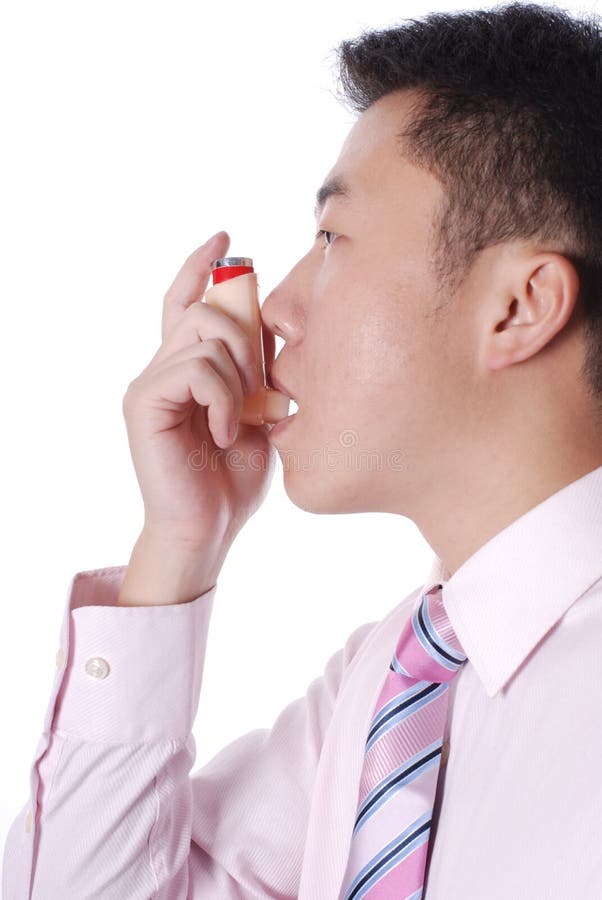 Asthma sufferer using an inhaler