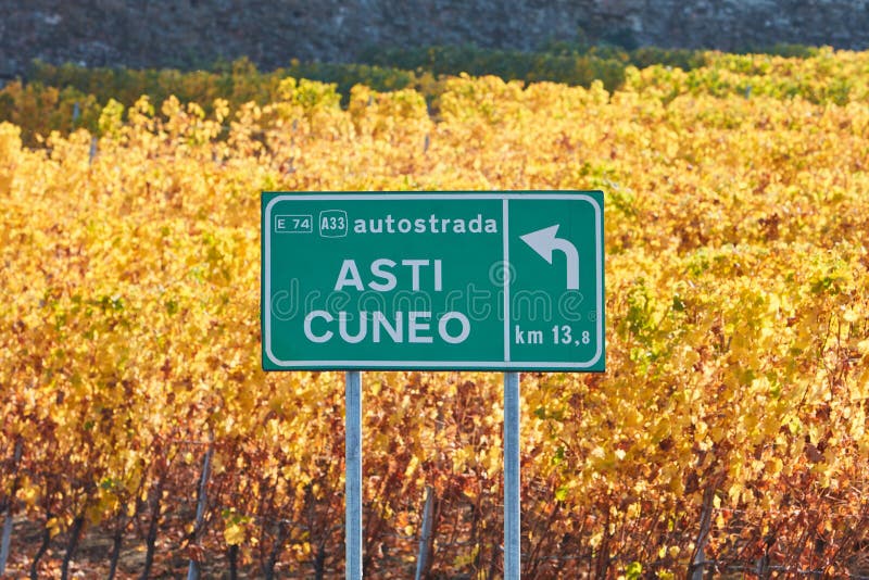 Asti Cuneo motorway street sign and vineyard in autumn in Italy royalty free stock images Asti Cuneo motorway street sign and vineyard in autumn in Italy royalty free stock images