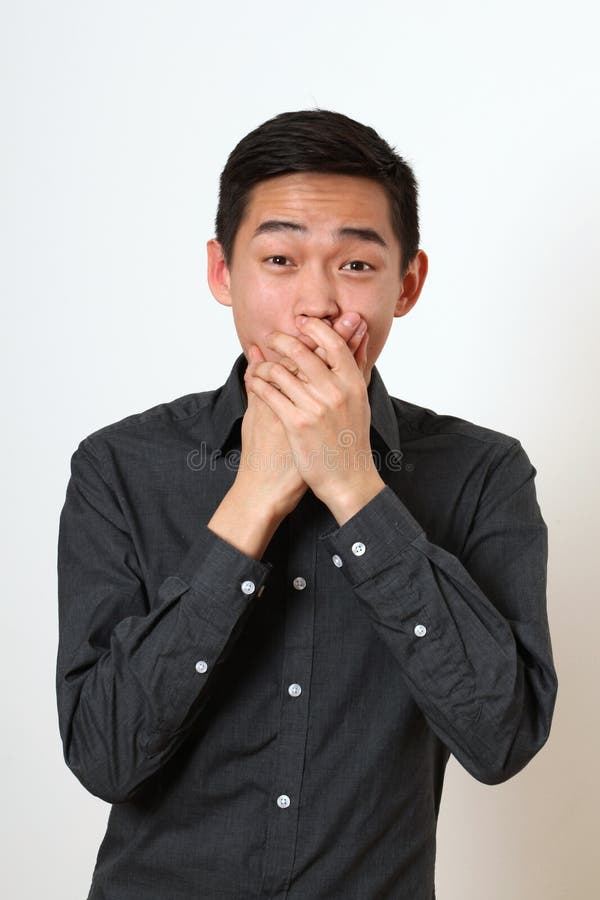 Astonished Young Asian Man Covering His Mouth with Hands Stock Image ...