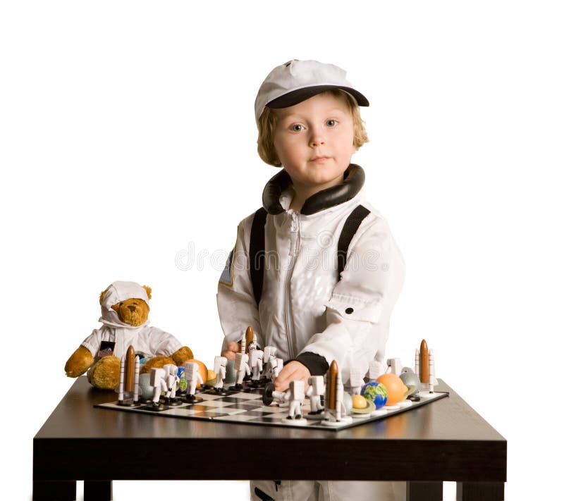 Astronaut boy playing chess