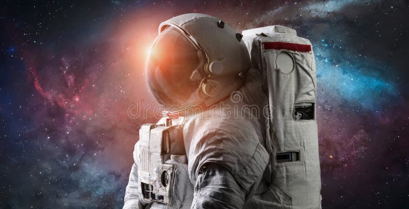 Astronaut in the space over the nightly planet Earth. Abstract wallpaper.  Spaceman. Elements of this image furnished by NASA Stock Photo