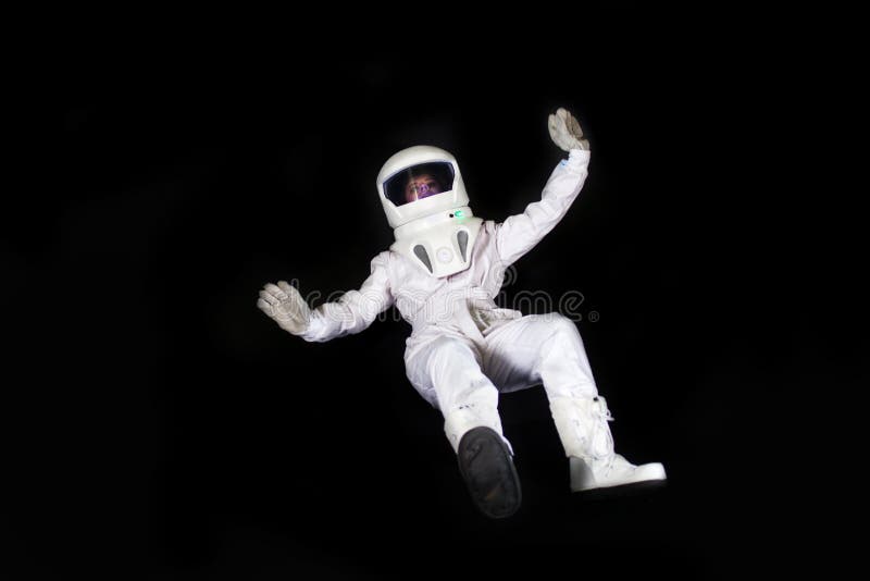 astronaut, standing spaceman isolated on black background Stock Photo -  Alamy