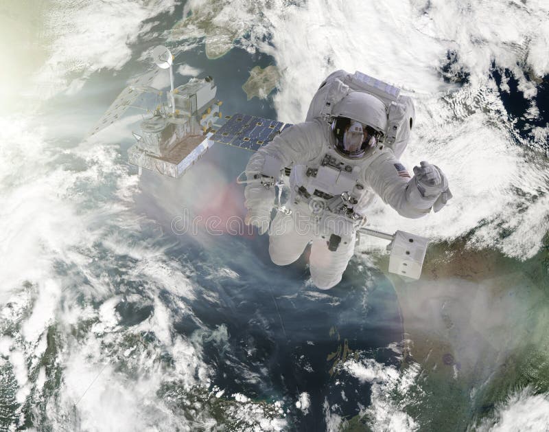 Astronauten arbeiten an den Satellitenelementen dieses Bildes geliefert von der NASA stockfotos Astronauten arbeiten an den Satellitenelementen dieses Bildes geliefert von der NASA stockfotos