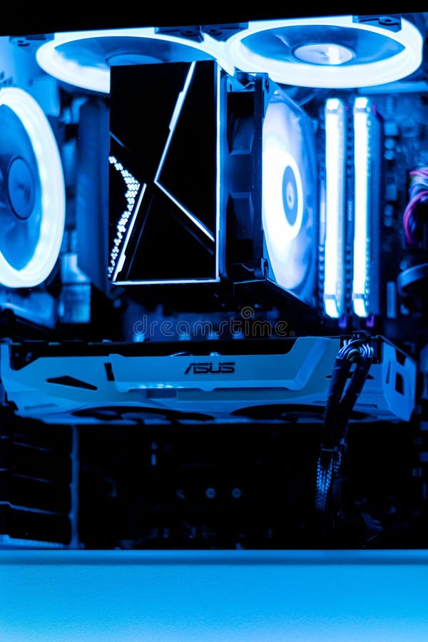 ASUS Computer on a Desk, with a Cooling Fan Providing Ventilation