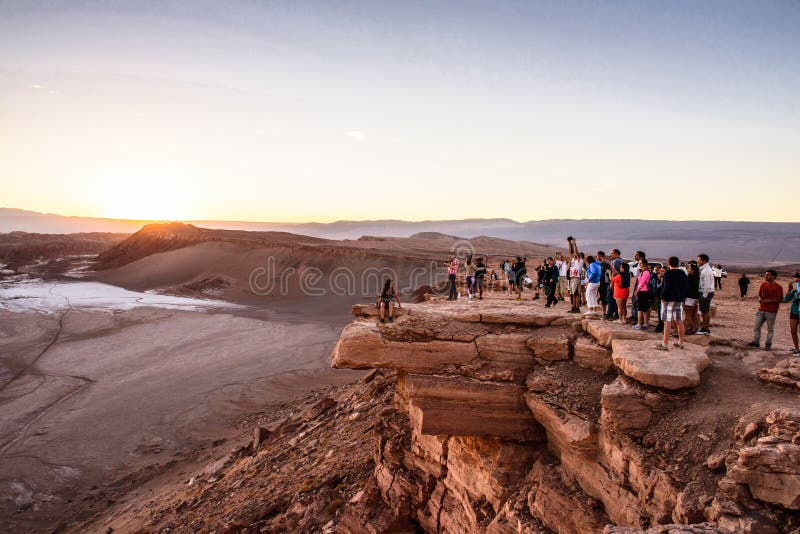 Atacama desert, Chile. NOV 3, 2014: Unidentified tourists in the . Atacama Desert proper occupies 105,000 square kilometres stock image Atacama desert, Chile. NOV 3, 2014: Unidentified tourists in the . Atacama Desert proper occupies 105,000 square kilometres stock image