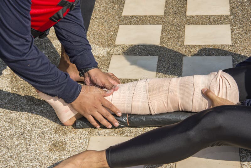 Elastic bandage apply pressure immobilized technique or PIT wind around left leg. Elastic bandage apply pressure immobilized technique or PIT wind around left leg