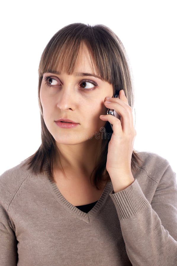 Atendimento fêmea novo pelo telemóvel imagem de stock Atendimento fêmea novo pelo telemóvel imagem de stock
