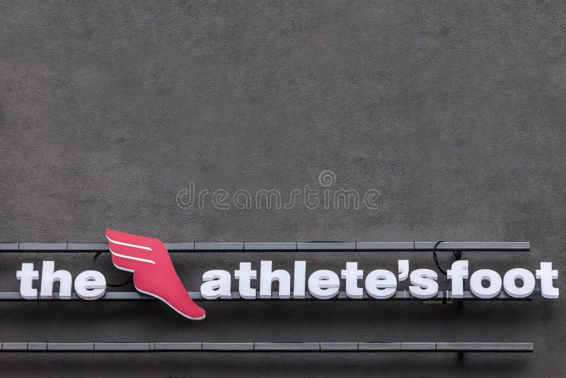 Athelete ` s nożny logo na ich głównym sklepie dla Belgrade Także zna jako TAF, ja jest szwajcarskim globalnym detalistą sportowy zdjęcia royalty free Athelete ` s nożny logo na ich głównym sklepie dla Belgrade Także zna jako TAF, ja jest szwajcarskim globalnym detalistą sportowy zdjęcia royalty free