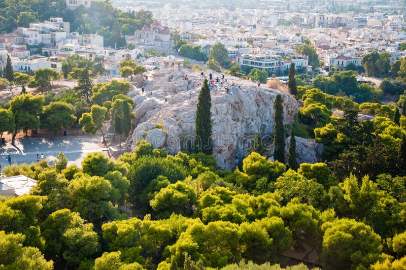 ATHENS-AUGUST 22: Tourists on Areopagus hill on August 22, 2014 in Athens, Greece. royalty free stock photos ATHENS-AUGUST 22: Tourists on Areopagus hill on August 22, 2014 in Athens, Greece. royalty free stock photos