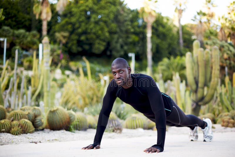 Athlete in Black Skin-tight Suit Pressed Stock Image - Image of