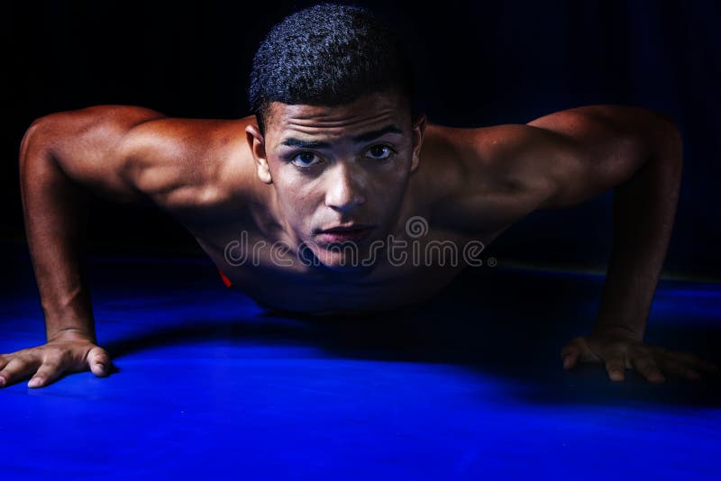 Wrestler lying on the mat stock photo. Image of culture 182952828