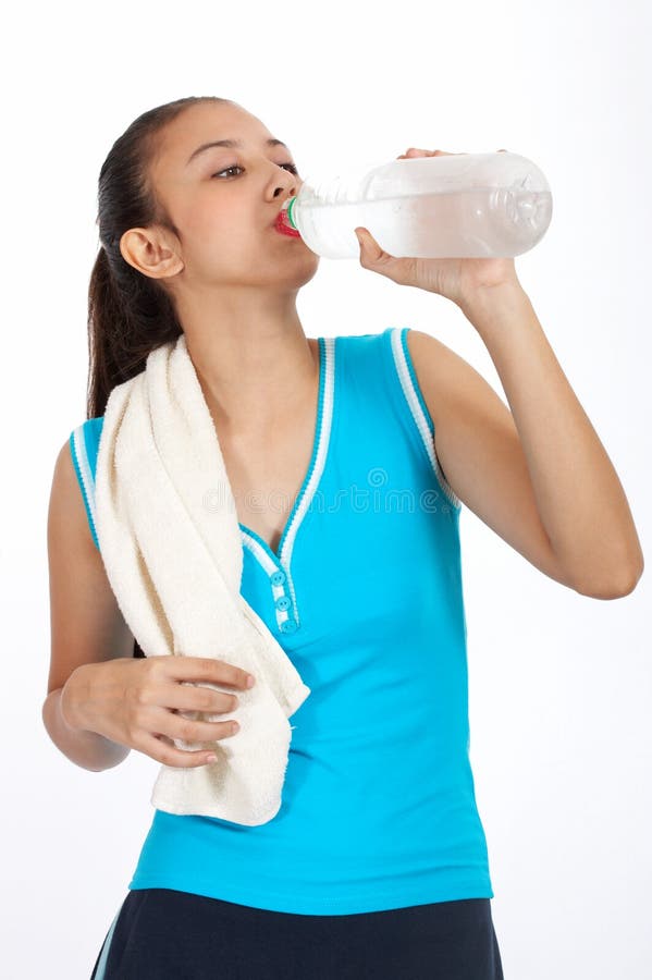 Athlete girl drinking water