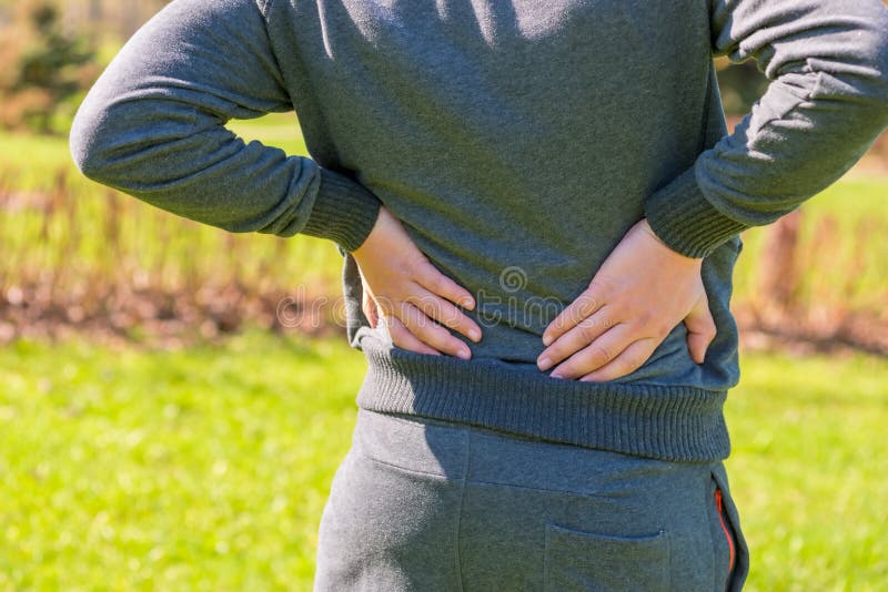 Athlete Holding Hands Sore Lower Back Stock Image Image of lumbar