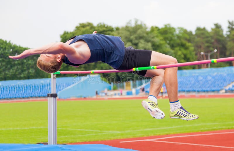 Athlete jumps in height royalty free stock photography