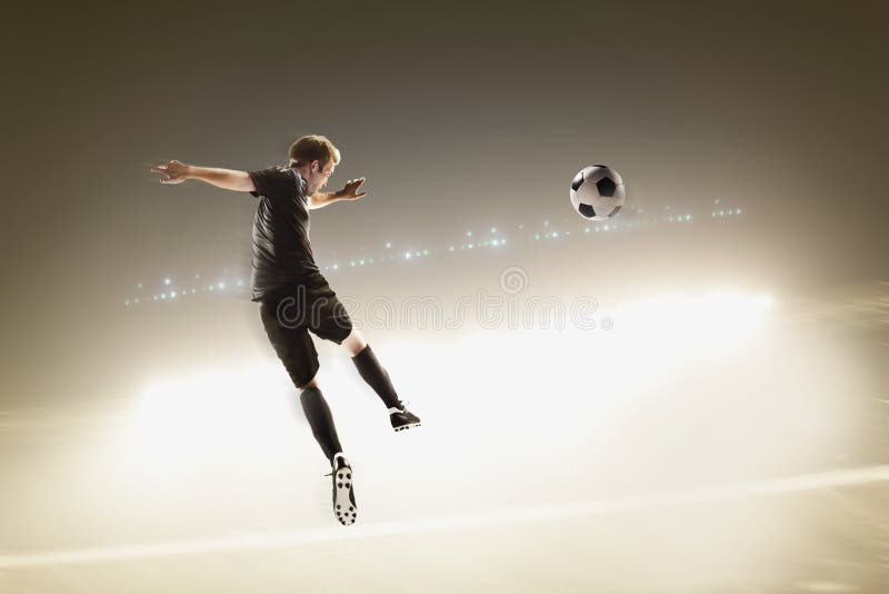 Two Soccer Players Kicking a Soccer Ball Stock Image Image of adult