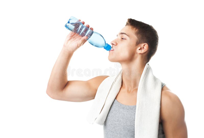 Young muscular athlete man with a white towel on his shoulder drinking water isolated on white background. Young muscular athlete man with a white towel on his shoulder drinking water isolated on white background