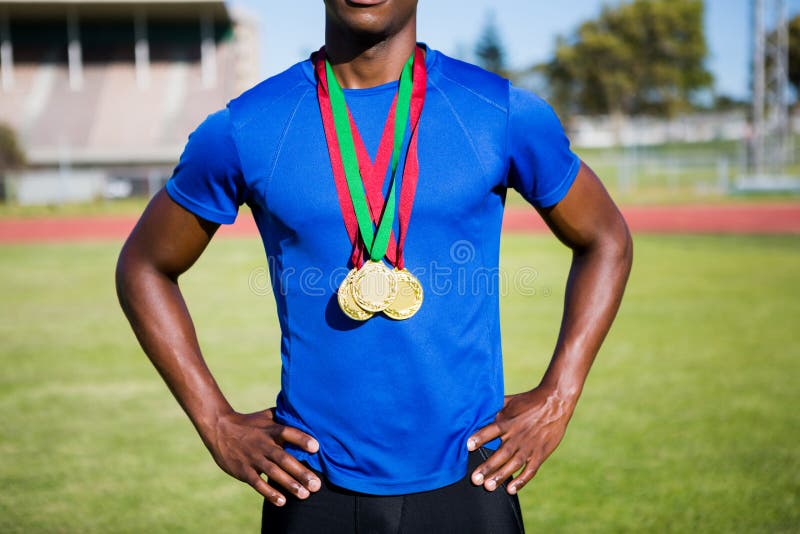 Athlete Posing with Gold Medals after Victory Stock Photo Image of