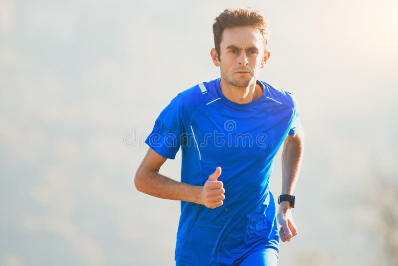 Athlete running in the mountains of the Italian national team in