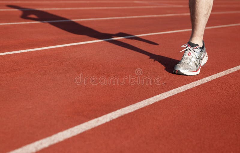 Athlete running on sports area