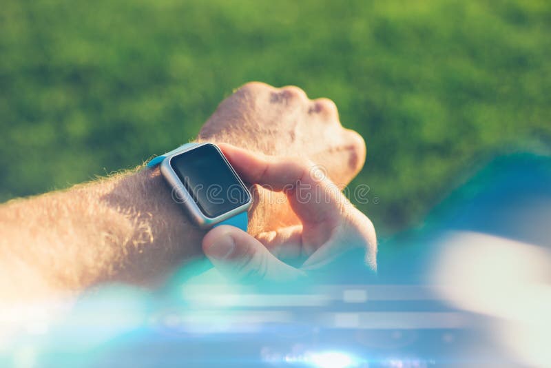 Athlete Touching His Smart Watch on the Wrist Stock Image - Image of body, action: 112483739
